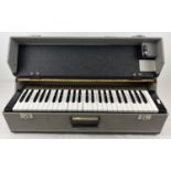 A vintage cased J Busilacchio MK1 standard electric reed organ. Approx. 67 x 29 x 19.5cm.
