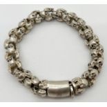 A heavy white metal multi skull link bracelet with push clasp. Total weight approx. 58g, total