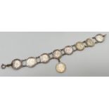 A vintage silver bracelet made from George V silver three pence coins, all dated 1911, 1915 and