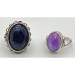 2 modern design silver stone set dress rings. One set with an oval cabochon of lapis lazuli and