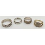 4 silver rings. One with square mount set with small round clear stones, other 3 in a band style all