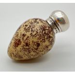 A Victorian novelty scent bottle modelled as a bird egg, with hallmarked silver lid. Porcelain light