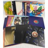 A collection of 36 assorted 1970's & 80's 12" vinyl records, all in good condition. To include: