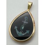 A 9ct gold and black onyx teardrop shaped pendant with anchor detail made with slices of opal.