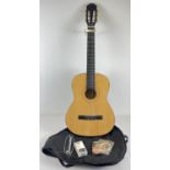 A JC-309F wooden cased classic acoustic guitar by Burswood. Complete with carry case, DVD, digital