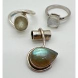 3 pieces of modern design semi precious stone set silver jewellery. A dress ring set with a