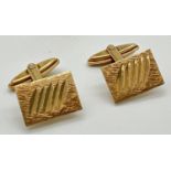 A pair of vintage 9ct gold square shaped cuff links with brushed detail & etched line decoration.