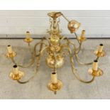 A large vintage 8 arm brass electrical ceiling light fitting with classical fish detail. Approx.