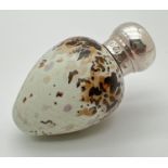 A Victorian novelty scent bottle modelled as a bird egg, with hallmarked silver lid. Porcelain