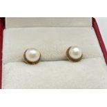 A pair of vintage 18ct gold pearl set stud earrings for pierced ears. Without butterfly backs.
