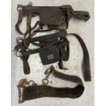 A collection of vintage heavy horse leather straps and harness to include Blinkers/blinders.