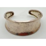 A 925 silver modern design cuff bangle with hammered finish. Marked 925 to inside. approx. 24.6g.