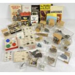A collection of mineral and rock specimens and related books. Lot includes: sample cards and samples