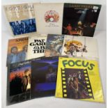 10 vintage mixed genre music LP records to include electronic and rock. Artists include Foreigner,