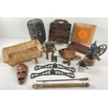 A box of assorted vintage wooden and metal items. To include: grinder, letter rack, carved animals