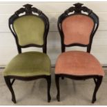 A pair of dark wood vintage chairs with carved detail to backs and studded upholstery. In green