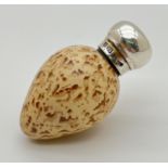 A Victorian novelty scent bottle modelled as a bird egg, with hallmarked silver lid. Porcelain beige