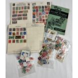 2 small vintage stamp albums containing British and world stamps. Together with a vintage Stamp