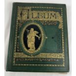 An early 20th century green scraps album with decorative gilt design to cover. Containing a quantity