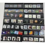 A collection of 14 sets of Royal Mail collectors stamps. To include: Peter Pan, The Weather,