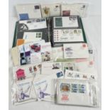 A collection of vintage and modern Royal Mail first day covers and used stamps. Lot also includes