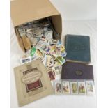 A box of assorted vintage cigarette cards, mostly loose, and some albums. Cards to include: