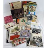 A box containing an assortment of mixed ephemera. To include: postcards & greeting cards, scraps,