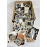 A box containing a large quantity of assorted vintage photographs, mostly black & white.