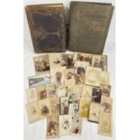 A late Victorian photograph album together with a collection of assorted portrait cabinet cards