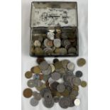 A small vintage black painted cash tin, with key, containing a collection of foreign coins. To