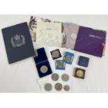A collection of British commemorative crowns, stamps and medallions. To include blister packed