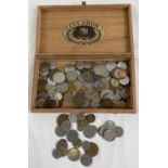 A wooden cigar box containing a collection of vintage foreign coins. To include examples from Kenya,
