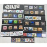 A collection of 13 sets of Royal Mail mint collectors stamp sets. To include: Christmas,