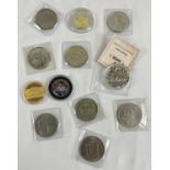 A collection of 12 British and world collectors crowns and coins. To include limited edition
