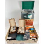 A vintage boxed Cabimat automatic slide projector together with a large collection of photographic
