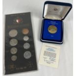A 1972 uncirculated set of decimal coins together with a boxed Royal Mint 1982 25th Anniversary of