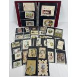 An album containing 150 assorted late Victorian/Edwardian greetings cards. Mostly Christmas and