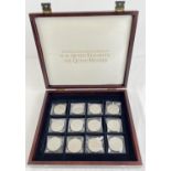 A wooden coin presentation box containing 12 British commemorative crowns. To include Silver