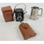 A vintage 'Lubitel 2' box shaped camera with original brown leatherette case. Together with a