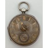A Victorian silver pocket watch (restoration needed). Gold markers to face with one hand. Front