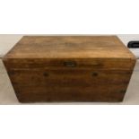 A vintage large fruitwood trunk with brass handle, corner bindings and inlay to lid. Double lock and
