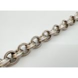 A 8.5 inch large belcher chain link bracelet with T bar clasp. Hallmarks to T bar. Total weight 91.