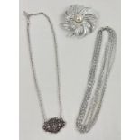 3 items of vintage costume jewellery by Sarah Coventry. A large silver tone floral style brooch