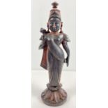 A carved hard wood figurine of an Oriental Deity. Approx. 34cm tall.