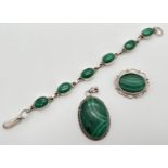 3 items of Malachite set silver jewellery. A large oval pendant, a small oval brooch with scallop