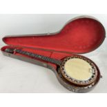 An early 20th century 'Windsor Artiste Model 4' 5 string banjo, in original case. Ebony