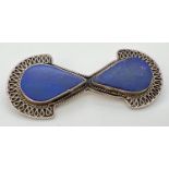 A modern design silver and Lapis Lazuli set brooch with scroll decoration. Silver mark to back.