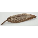 A vintage silver brooch in the shape of a feather. Complete with safety chain. Marked Silver to