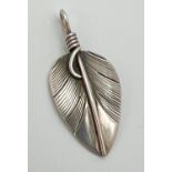 A Lena Platero Navajo tribe sterling silver pendant modelled as a feather. Marks and makers name