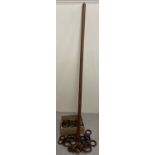 A vintage dark wood curtain pole together with finials, brass hanging brackets & a quantity of